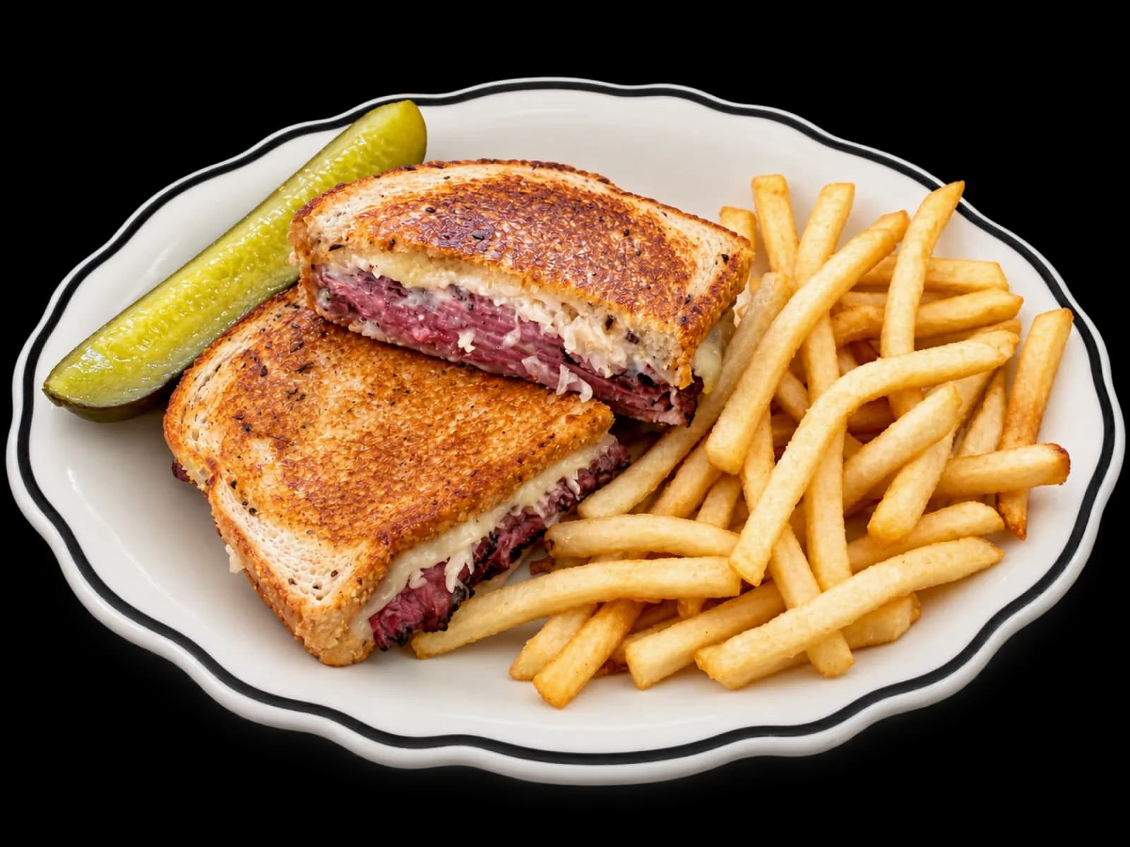 Pastrami Reuben sandwich with fries and a pickle