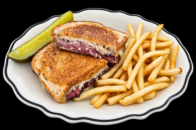 A Reuben sandwich with fries